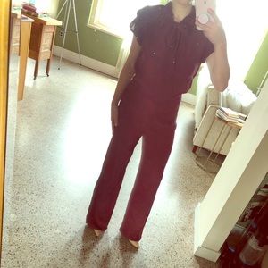 Maroon jumpsuit with sexy bow tie neck and back!
